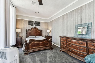 Nestled on a beautifully positioned corner lot directly across on Clearwater Country Club in Florida - for sale on GolfHomes.com, golf home, golf lot