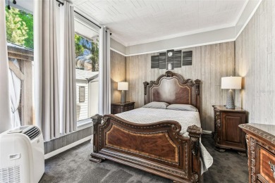 Nestled on a beautifully positioned corner lot directly across on Clearwater Country Club in Florida - for sale on GolfHomes.com, golf home, golf lot