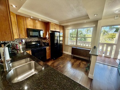 WELCOME to easy FLORIDA living in this uniquely enhanced 2/2 on Wynmoor Golf Course in Florida - for sale on GolfHomes.com, golf home, golf lot