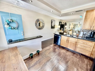 WELCOME to easy FLORIDA living in this uniquely enhanced 2/2 on Wynmoor Golf Course in Florida - for sale on GolfHomes.com, golf home, golf lot