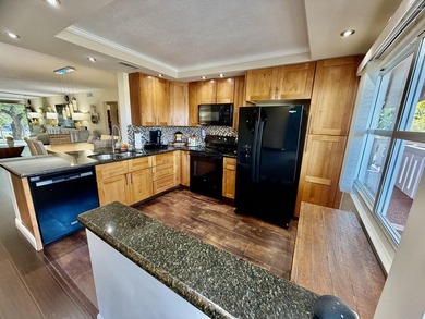 WELCOME to easy FLORIDA living in this uniquely enhanced 2/2 on Wynmoor Golf Course in Florida - for sale on GolfHomes.com, golf home, golf lot