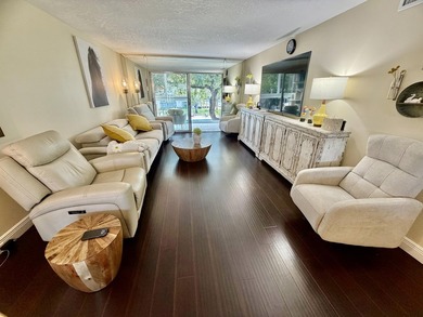 WELCOME to easy FLORIDA living in this uniquely enhanced 2/2 on Wynmoor Golf Course in Florida - for sale on GolfHomes.com, golf home, golf lot