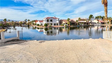 Rare 58-foot-wide waterfront lot on the middle lake in the on Los Lagos Golf Club in Arizona - for sale on GolfHomes.com, golf home, golf lot