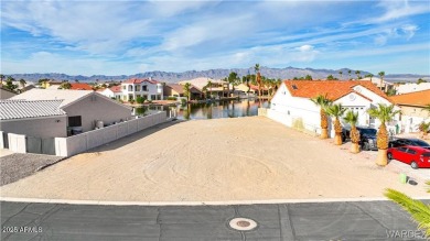Rare 58-foot-wide waterfront lot on the middle lake in the on Los Lagos Golf Club in Arizona - for sale on GolfHomes.com, golf home, golf lot