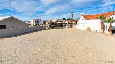 Rare 58-foot-wide waterfront lot on the middle lake in the on Los Lagos Golf Club in Arizona - for sale on GolfHomes.com, golf home, golf lot