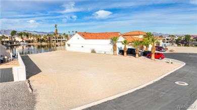 Rare 58-foot-wide waterfront lot on the middle lake in the on Los Lagos Golf Club in Arizona - for sale on GolfHomes.com, golf home, golf lot