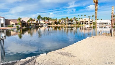 Rare 58-foot-wide waterfront lot on the middle lake in the on Los Lagos Golf Club in Arizona - for sale on GolfHomes.com, golf home, golf lot