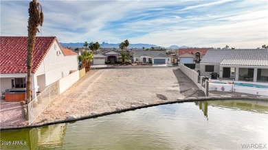 Rare 58-foot-wide waterfront lot on the middle lake in the on Los Lagos Golf Club in Arizona - for sale on GolfHomes.com, golf home, golf lot