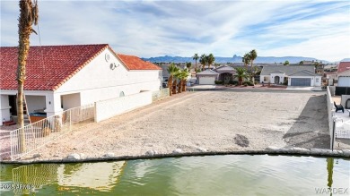 Rare 58-foot-wide waterfront lot on the middle lake in the on Los Lagos Golf Club in Arizona - for sale on GolfHomes.com, golf home, golf lot
