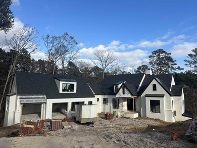 Welcome to 1040 Sunrise Court, a stunning new construction on Reynolds Lake Oconee - The Oconee in Georgia - for sale on GolfHomes.com, golf home, golf lot