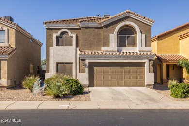 This expansive home overlooks the 9th hole of the golf course on Oasis Golf Club in Arizona - for sale on GolfHomes.com, golf home, golf lot