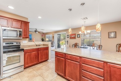 This expansive home overlooks the 9th hole of the golf course on Oasis Golf Club in Arizona - for sale on GolfHomes.com, golf home, golf lot