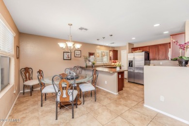 This expansive home overlooks the 9th hole of the golf course on Oasis Golf Club in Arizona - for sale on GolfHomes.com, golf home, golf lot