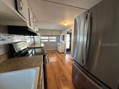 NO LOT RENT, it is a deeded lot, 2 bedrooms 1-1/2 Baths on Tooke on Glen Lakes Country Club in Florida - for sale on GolfHomes.com, golf home, golf lot