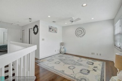 Beautiful 3BR/2.5BA townhouse with stunning golf and lake views on Woodmont Country Club in Florida - for sale on GolfHomes.com, golf home, golf lot