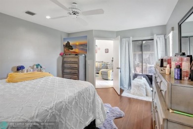 Beautiful 3BR/2.5BA townhouse with stunning golf and lake views on Woodmont Country Club in Florida - for sale on GolfHomes.com, golf home, golf lot
