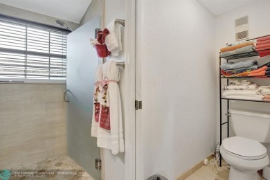 Beautiful 3BR/2.5BA townhouse with stunning golf and lake views on Woodmont Country Club in Florida - for sale on GolfHomes.com, golf home, golf lot