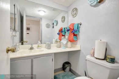 Beautiful 3BR/2.5BA townhouse with stunning golf and lake views on Woodmont Country Club in Florida - for sale on GolfHomes.com, golf home, golf lot