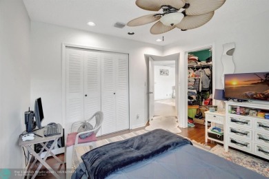 Beautiful 3BR/2.5BA townhouse with stunning golf and lake views on Woodmont Country Club in Florida - for sale on GolfHomes.com, golf home, golf lot
