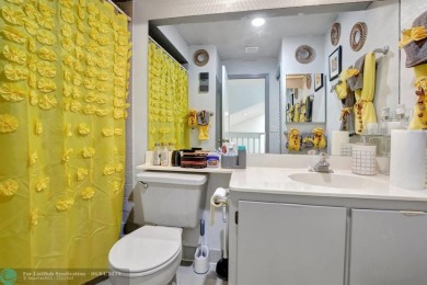 Beautiful 3BR/2.5BA townhouse with stunning golf and lake views on Woodmont Country Club in Florida - for sale on GolfHomes.com, golf home, golf lot