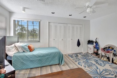 Beautiful 3BR/2.5BA townhouse with stunning golf and lake views on Woodmont Country Club in Florida - for sale on GolfHomes.com, golf home, golf lot