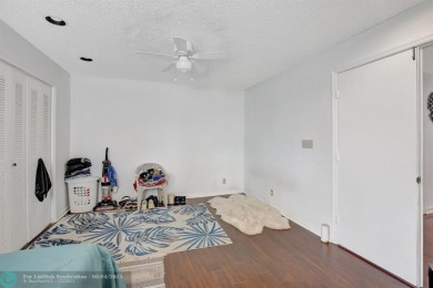 Beautiful 3BR/2.5BA townhouse with stunning golf and lake views on Woodmont Country Club in Florida - for sale on GolfHomes.com, golf home, golf lot
