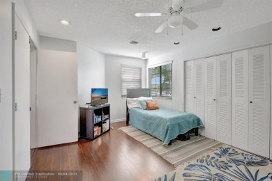 Beautiful 3BR/2.5BA townhouse with stunning golf and lake views on Woodmont Country Club in Florida - for sale on GolfHomes.com, golf home, golf lot