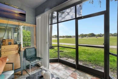 Beautiful 3BR/2.5BA townhouse with stunning golf and lake views on Woodmont Country Club in Florida - for sale on GolfHomes.com, golf home, golf lot