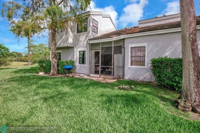 Beautiful 3BR/2.5BA townhouse with stunning golf and lake views on Woodmont Country Club in Florida - for sale on GolfHomes.com, golf home, golf lot