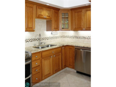Your dream home with sweeping golf course and pond views! This on Palm-Aire Country Club and Resort - The Oaks in Florida - for sale on GolfHomes.com, golf home, golf lot