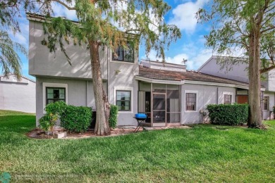 Beautiful 3BR/2.5BA townhouse with stunning golf and lake views on Woodmont Country Club in Florida - for sale on GolfHomes.com, golf home, golf lot