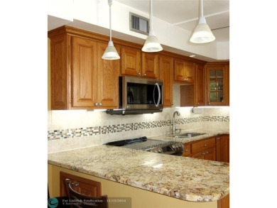 Your dream home with sweeping golf course and pond views! This on Palm-Aire Country Club and Resort - The Oaks in Florida - for sale on GolfHomes.com, golf home, golf lot