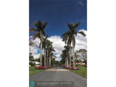 Your dream home with sweeping golf course and pond views! This on Palm-Aire Country Club and Resort - The Oaks in Florida - for sale on GolfHomes.com, golf home, golf lot