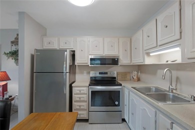 55+ Community ~ Adorable 1 bedroom, 1 bath & 1 carport condo on Summertree Golf Course in Florida - for sale on GolfHomes.com, golf home, golf lot