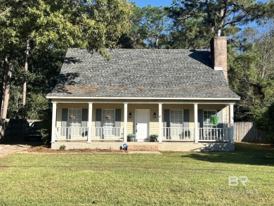 INVESTOR SPECIAL! This delightful Creole-style residence offers on Lake Forest Yacht and Country Club in Alabama - for sale on GolfHomes.com, golf home, golf lot