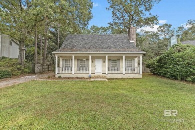 INVESTOR SPECIAL! This delightful Creole-style residence offers on Lake Forest Yacht and Country Club in Alabama - for sale on GolfHomes.com, golf home, golf lot