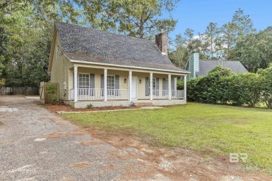 INVESTOR SPECIAL! This delightful Creole-style residence offers on Lake Forest Yacht and Country Club in Alabama - for sale on GolfHomes.com, golf home, golf lot