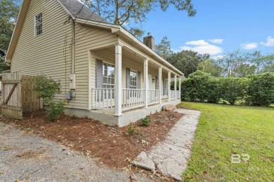 INVESTOR SPECIAL! This delightful Creole-style residence offers on Lake Forest Yacht and Country Club in Alabama - for sale on GolfHomes.com, golf home, golf lot