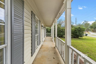 INVESTOR SPECIAL! This delightful Creole-style residence offers on Lake Forest Yacht and Country Club in Alabama - for sale on GolfHomes.com, golf home, golf lot