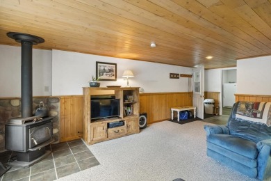 Welcome to this beautiful Colonial-style home located in the on Indian River Golf Club in Michigan - for sale on GolfHomes.com, golf home, golf lot