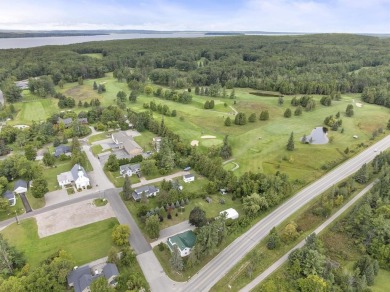 Welcome to this beautiful Colonial-style home located in the on Indian River Golf Club in Michigan - for sale on GolfHomes.com, golf home, golf lot