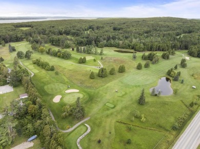 Welcome to this beautiful Colonial-style home located in the on Indian River Golf Club in Michigan - for sale on GolfHomes.com, golf home, golf lot