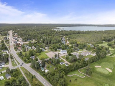 Welcome to this beautiful Colonial-style home located in the on Indian River Golf Club in Michigan - for sale on GolfHomes.com, golf home, golf lot