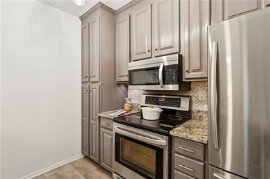 Experience city living at its best in this beautifully on Bobby Jones Golf Club in Georgia - for sale on GolfHomes.com, golf home, golf lot