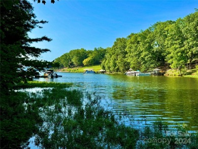 Beautiful lake front nearly flat lot located in the Long Cove on Old North State Club at Uwharrie Point Golf community in North Carolina - for sale on GolfHomes.com, golf home, golf lot