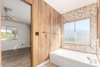 Don't miss this adorable 2-bedroom mobile home in Apache Wells! on Apache Wells Country Club in Arizona - for sale on GolfHomes.com, golf home, golf lot