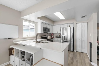 Welcome to your Pine Lakes Paradise! Tucked away on a tranquil on The Grand Club - Pine Lakes Course in Florida - for sale on GolfHomes.com, golf home, golf lot