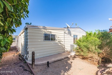 Don't miss this adorable 2-bedroom mobile home in Apache Wells! on Apache Wells Country Club in Arizona - for sale on GolfHomes.com, golf home, golf lot