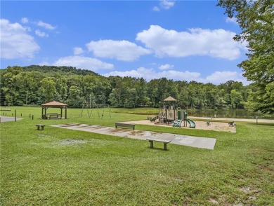 Nestled in the serene gated community of Bent Tree, this home on Bent Tree Golf Course in Georgia - for sale on GolfHomes.com, golf home, golf lot