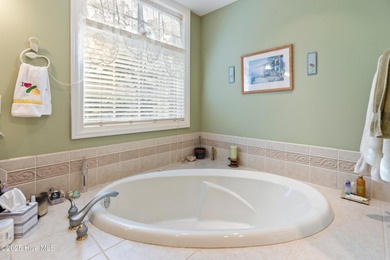 Welcome to this stunning 2,934 sq. ft. custom-built brick home on Carolina National Golf Club in North Carolina - for sale on GolfHomes.com, golf home, golf lot